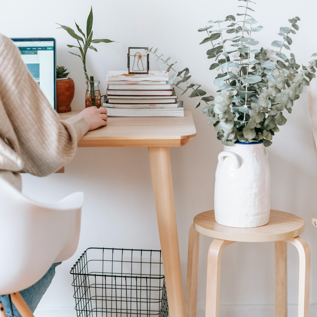 Person with laptop sitting at desk