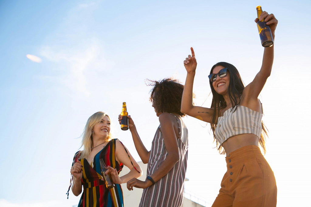 Three women celebrating on the roof